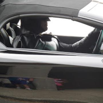 Batman driving a Chevy Camaro